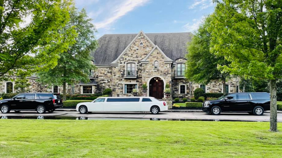 limo in front of a large home