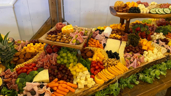 large fruit and cheese board at an event